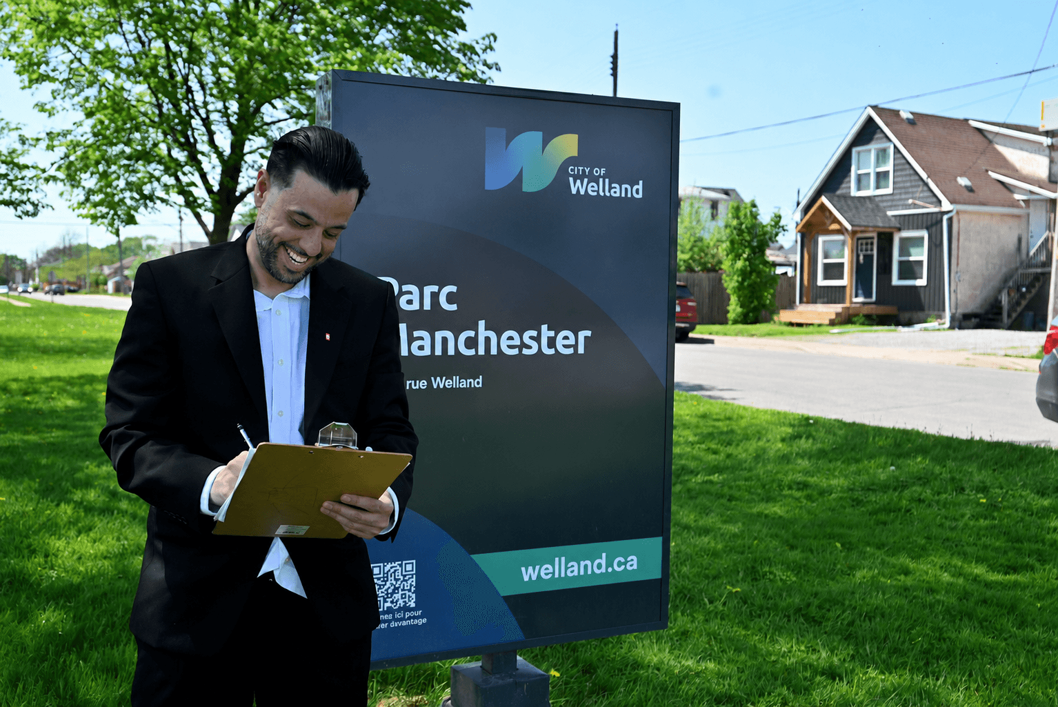 Luca Mele standing in a Welland neighbourhood